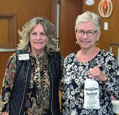 Calling bingo in Weimar at First United Methodist Church on Tuesday, Nov. 19 was Anne Frye (left) of Texas Home Health. Peggy Hiatt (right) was the lucky winner of the blackout prize. She received two pounds of high-quality ground beef from Texas beef.