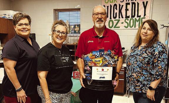 Presentation at Schulenburg Secondary/Junior High – (from left) Cheryl Brossmann, FSB; Amy Brenner, paraprofessional; Mike Olle, FSB; and Melissa Adcox, seventh and eighth grade science.