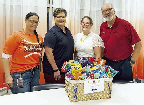 Presentation at Schulenburg Elementary – (from left) Adina Barnett, fifth grade science; Cheryl Brossmann, FSB lobby manager-Schulenburg; Ashley de la Garza, counselor; and Mike Olle, FSB.