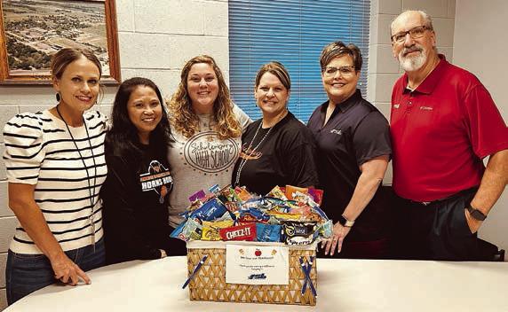 Presentation at Schulenburg High – (from left) Jamie Lusk, ninth and 12th English; Mercy Silcox, chemistry and physics; Allison Machac, counselor; Amy Thibodeaux, biology and anatomy; and Cheryl Brossmann and Mike Olle, FSB.