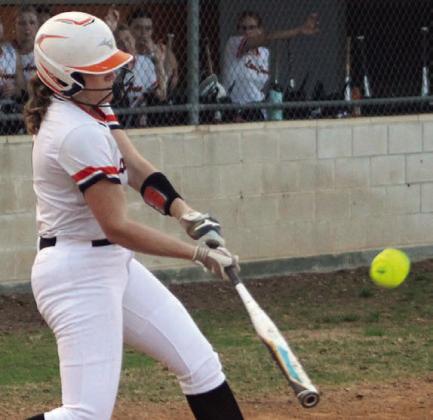 Hailey Kahlden connects for the first of her three hits Friday, driving in a run in the bottom of the first inning. Sticker Photo By Darrell Vyvjala