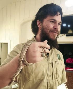 Speaker was E. Drake Rangel (left photo) of Texas Parks &amp;amp; Wildlife, who discussed snakes. Member Jan Ripper (right photo) holds a snake during the program.