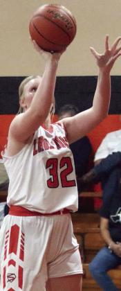 Ava Bubela scores under the basket in the second quarter. Sticker Photo By Darrell Vyvjala