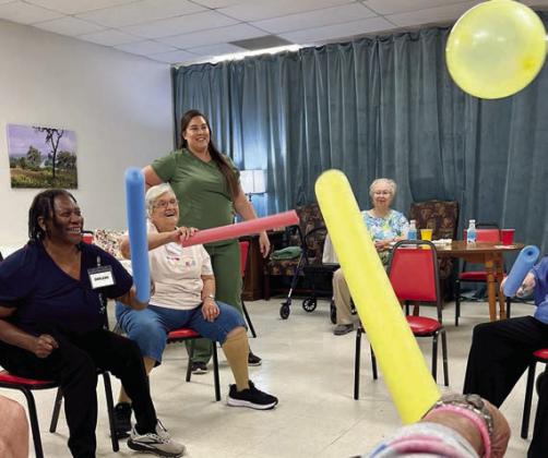 Fun and games on Fun Day Monday – (from left) Darlene Williams, Cynthia Meyer, Amanda McCullar from Paradigm at the Oak nursing home and Aileen Kasper. Everyone had so much fun that they laughed until they cried!
