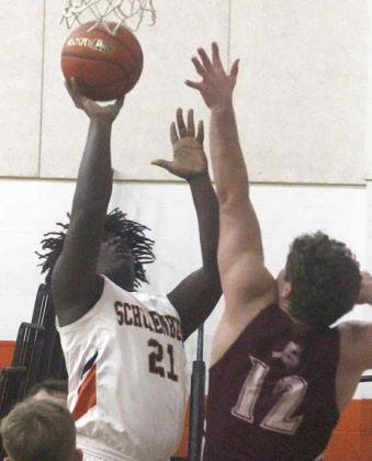 Tavondrick Ellison scores in the paint in the third period. Sticker Photo By Darrell Vyvjala