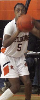 DeMarion Glass lines up a threepointer in the fourth quarter. Sticker Photo By Darrell Vyvjala