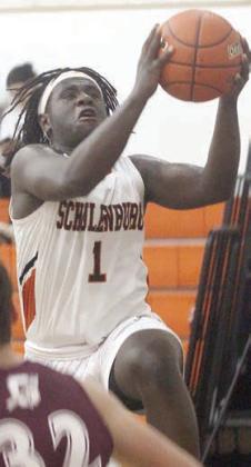 Rodney H Walton goes to the basket for two of his 10 points in the third quarter. Sticker Photo By Darrell Vyvjala