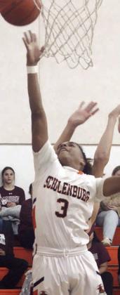 Byron Johnson drives in for a layup in the first quarter. Sticker Photo By Darrell Vyvjala