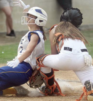 Catcher Mikayla Stang tags out a Lady Hornet in the first game of last Tuesday’s doubleheader. Sticker Photo By Darrell Vyvjala