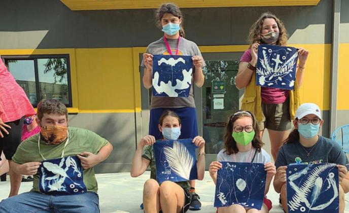 CYANOTYPING – And Then members displaying their cyanotype artwork are (front row, from left) Logan Carroll, Victoria Spindler, Joelle Mihavolich-Williams, Kelsee Cowart, (back row) Jessica Shank and Mary Wellborn.