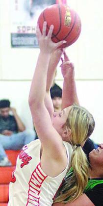Saybra Pinney pulls down an offensive rebound in the second quarter. Sticker Photo By Darrell Vyvjala