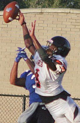 Kenny King skies to break up a pass in last Thursday's scrimmage. Sticker Photo By Darrell Vyvjala