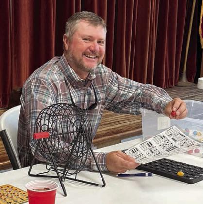 Colorado County Commissioner Ryan Brandt joined Senior Connections in Weimar for a lunch-and-learn program, then hung around a little while to call some bingo. He told about his duties in his position, including overseeing road maintenance in his precinct, filling potholes and keeping the grass mowed. He’s also responsible for maintaining the fairgrounds in Colorado County. He brought a cake that he baked himself and it was used as a bingo prize for a blackout game.