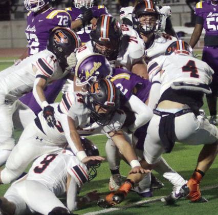 Bringing down Caden Judie for a loss of 3 in the second quarter are Jayse Janda (No. 4), Aidan Mendez (No. 44), Adin Beyer (No. 9), Nick Goode (No. 11, Marshall Wellborn (No. 70), and Preston Kahn (No. 50). Sticker Photo By Layne Vyvjala