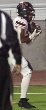 Byron Johnson gathers in a touchdown pass in the back of the end zone in the second quarter. Sticker Photo By Layne Vyvjala