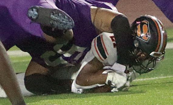 Demarrion Glass pounces on a loose ball for a fumble recovery in the second quarter. Sticker Photo By Layne Vyvjala