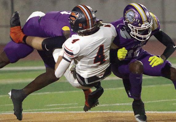 Jayse Janda gets upended after a second-quarter reception but holds on for a 29-yard gain. Sticker Photo By Layne Vyvjala