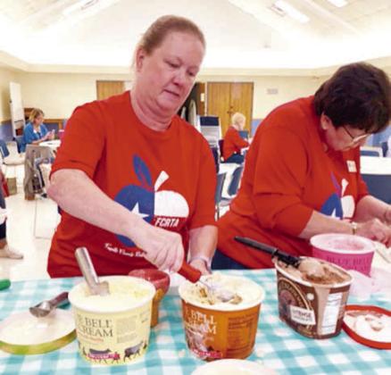 Prep aring sundaes with all the fixings were Lisa Slinkard and Jeanne Wetjen.