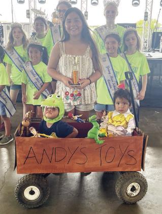 Third Place – “Andy’s Toy Box” - Zailynne, Bellamy, and Oaklyn Manzano. Sticker Photo By Darrell Vyvjala
