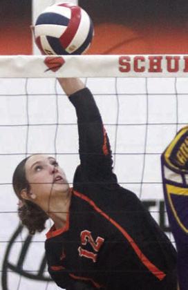 Grace Schramek makes a twisting attack in the third set on Friday. Sticker Photo By Darrell Vyvjala