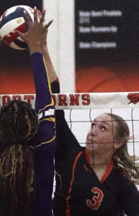 Reagan Dusek powers a kill over the net in game one against Weimar. Sticker Photo By Darrell Vyvjala