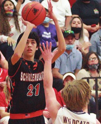 Alex Lozano sends a three-pointer on its way early in the second quarter. Sticker Photo By Layne Vyvjala