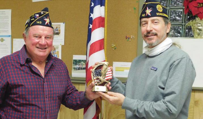 McBride Post 143 Commander Bob Heinrich (left) presents the 2020 “Legionnaire of the Year” award to Ed Semler.