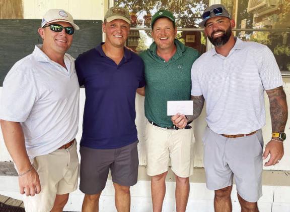 First Flight, 1st Place (13 under par / 59) – (from left) Adam Hudec, Wes Matej, Clint Dunham, and Mason Thompson.