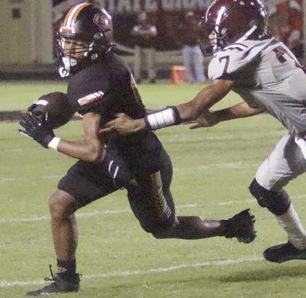 Byron Johnson turns upfield after a short reception to gain 12 yards in the third quarter. Sticker Photo By Layne Vyvjala