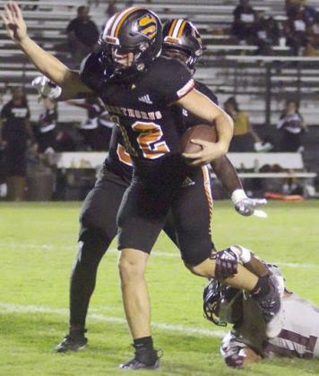 Two of Schulenburg’s biggest plays on defense – Marshall Wellborn (left) sacks Hearne quarterback Kemon Langham on fourth down in the first quarter and Owen Brenek (right) slips through an Eagle tackle during his 28-yard interception return in the second quarter. Sticker Photos By Layne Vyvjala
