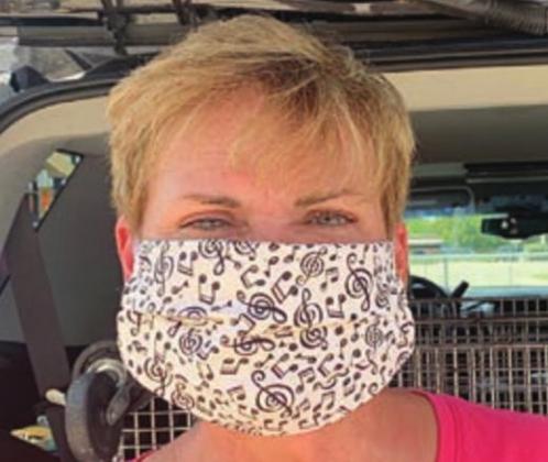 Another example of a specialty mask that is reversible is the music-themed mask at left, being worn by Carrie Castleman in the photo at right.