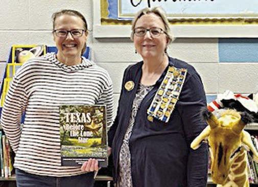 SACRED HEART-LAGRANGE presentation – (from left) Chris Kosler, Sacred Heart Catholic School library; and Kim Joost, chapter librarian, Smith-McMillan Chapter, NSDAR