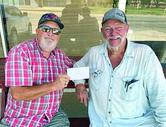 The Schulenburg Young Farmers recently donated $1,000 to the Texas Ramp Project, which builds handicap ramps for disabled or elderly people who can’t afford one. Accepting the check on behalf of the Texas Ramp Project was Frank Smith (left), and presenting the check was Ed Moeller (right) on behalf of the Schulenburg Young Farmers.