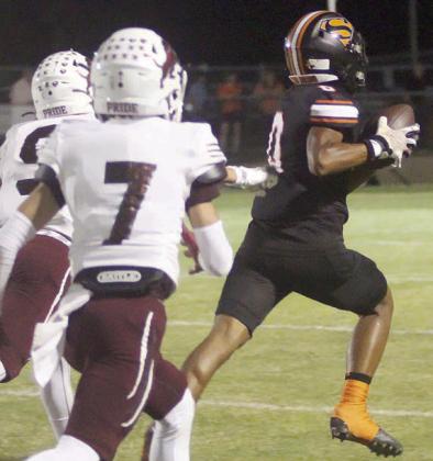 Byron Johnson secures a reception after beating double coverage for a 49-yard touchdown in the first quarter. Sticker Photo By Layne Vyvjala