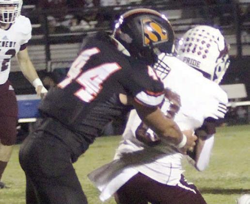 Aidan Mendez tackles Karsen Reyes for a loss of 3 in the second quarter. Sticker Photo By Layne Vyvjala