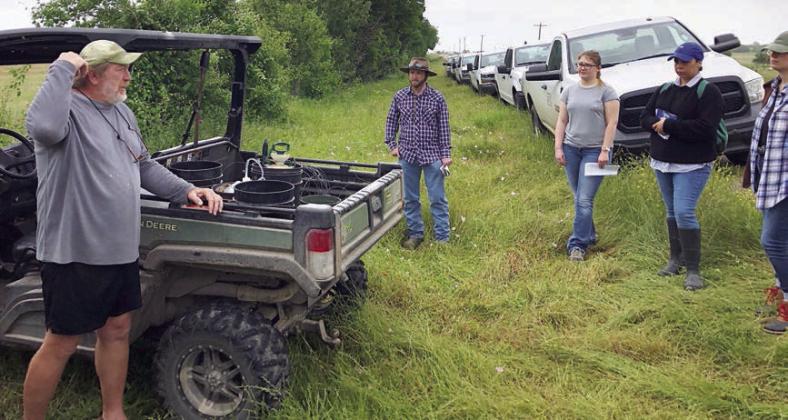 After retirement, Glen Minzenmeyer (left) is still helping share the conservation message by helping train new NRCS employees at his ranch in Fayette County.