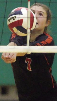 Landry Zapalac digs a Lady Eagle attack in the third set. Sticker Photo By Darrell Vyvjala