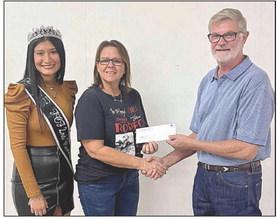 FAYETTE COUNTY SHERIFF’S POSSE received a donation of $2,366. Shown are (from left) second runner-up Andrea Ortiz, FCSP representative Deanna Toddy and Fair president Mike Zuhn.