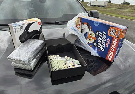Shown above are the two kilos of cocaine and the cereal box in which they were located along with the $10,000 cash was found inside a headphones box.