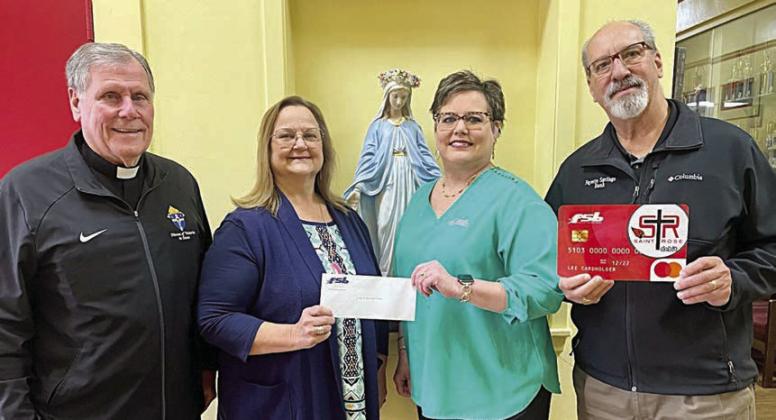 On hand as Fayette Savings Bank presented a check to St. Rose School through its School Spirit Debit Card Program were (from left) Rev. Jasper Liggio, St. Rose of Lima Catholic Church pastor; Rosanne Gallia, St. Rose School principal; and Cheryl Brossmann and Mike Olle, representing Fayette Savings Bank.