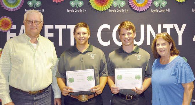 Emily Fritsch 4-H Scholarship – (from left) presenter Lee Fritsch; recipients Railey Nieto and Cooper Mau;  presenter Mrs. Phyllis Fritsch; and (not shown) recipient  Kayme Schley.