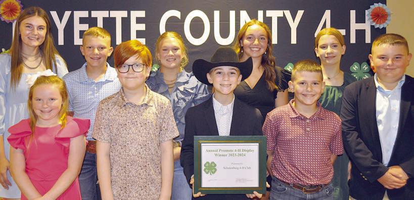 Display Booth Winner – Schulenburg 4-H, represented by (front row, from left) Abigale McBride, Clay  Hoffmann, Crockett Guenther, Hudson Holub, Abraham McBride, (back row) Madyson Holub, Holden Holub, Haley Schramek, Mikayla Otto and Kylee Hoffmann.