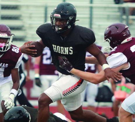 DaTerrion Houston gets by a Brahma for a 10-yard run. Sticker Photo By Darrell Vyvjala