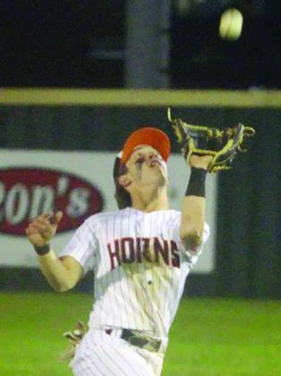 Cooper Demel tracks a high infield popup into his glove against Flatonia. Sticker Photo By Darrell Vyvjala