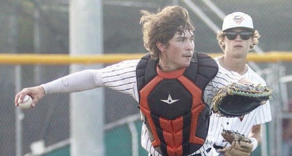 Catcher Jayse Janda throws out a Trojan after a sacrifice bunt in the top of the third inning during game two. Sticker Photo By Darrell Vyvjala