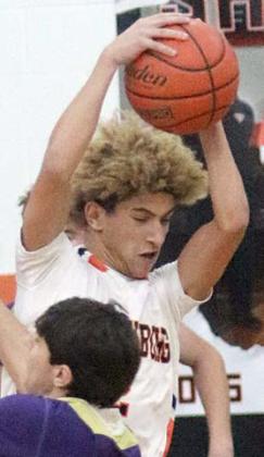 Denver Carr picks off a Comanche pass in the first quarter. Sticker Photo By Darrell Vyvjala