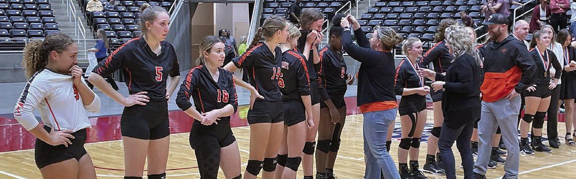 High School Principal Callene Zapalac, Superintendent Dr. Julie Motomura, and Athletic Director Luke Hobbs present the Lady Horns with their state medals following the loss to Iola. Sticker Photo By Darrell Vyvjala