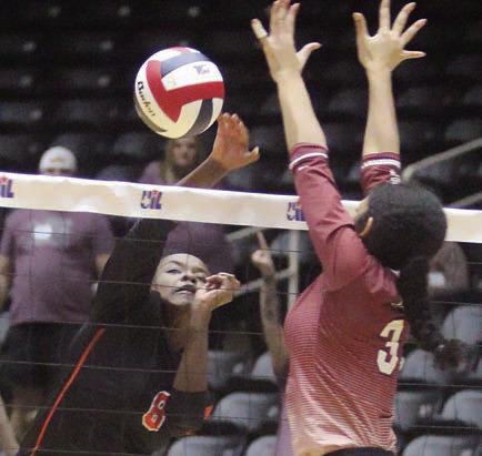Jessalyn Gipson goes cross-court for a kill in game four. Sticker Photo By Darrell Vyvjala