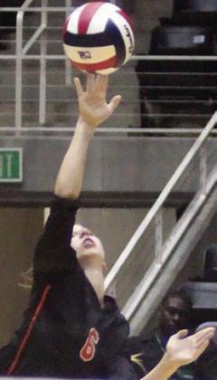 Clara Magliolo serves an ace in the first set. Sticker Photo By Darrell Vyvjala