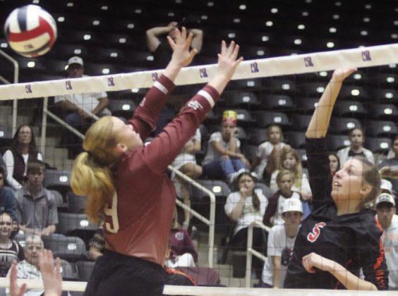 Brooke Redding gets an attack past a Lady Bulldog block in the third set Sticker Photo By Darrell Vyvjala